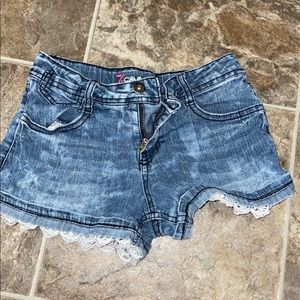 Jean shorts with lace detail at the bottom